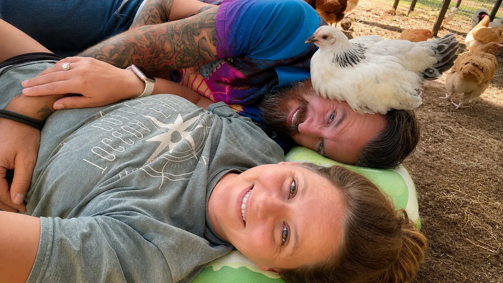 Mr. and Ms. Darlin' in the yard with a hen