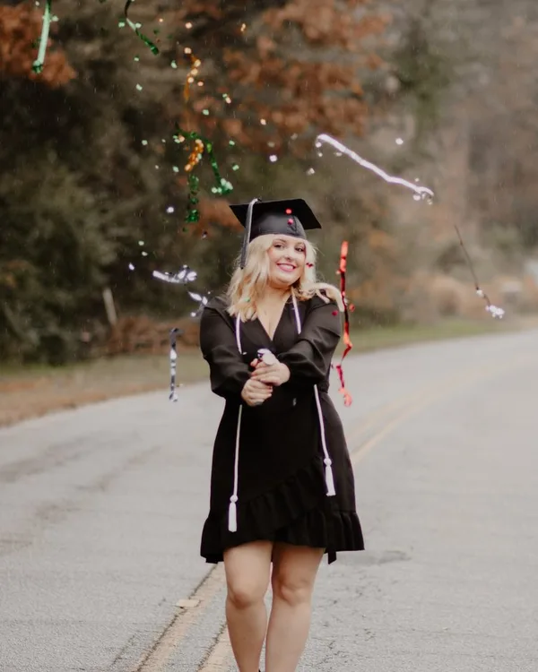 Big D Darlin' in a graduation cap and gown
